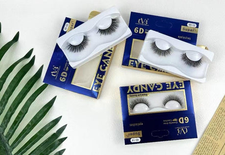 Eyelash products with packaging on a white surface