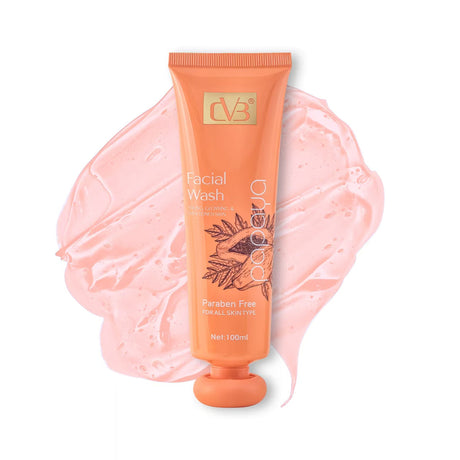 Facial wash tube with pink gel smear on a white background