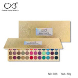 Makeup palette with gold packaging and visible color swatches on a white background