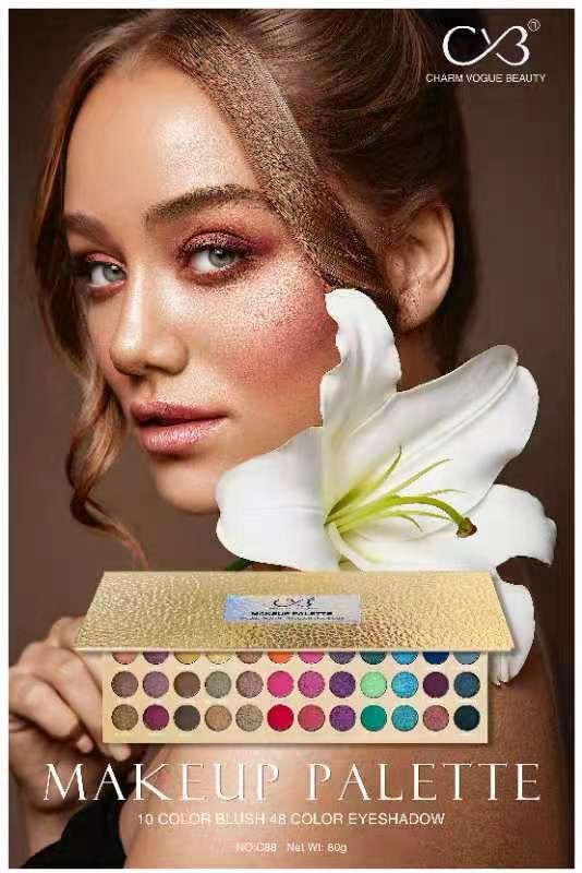 Makeup palette with a model wearing glittery makeup and a white lily.