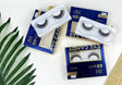 Eyelash products with packaging on a white surface