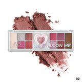 Makeup palette with crushed powder samples on a white background