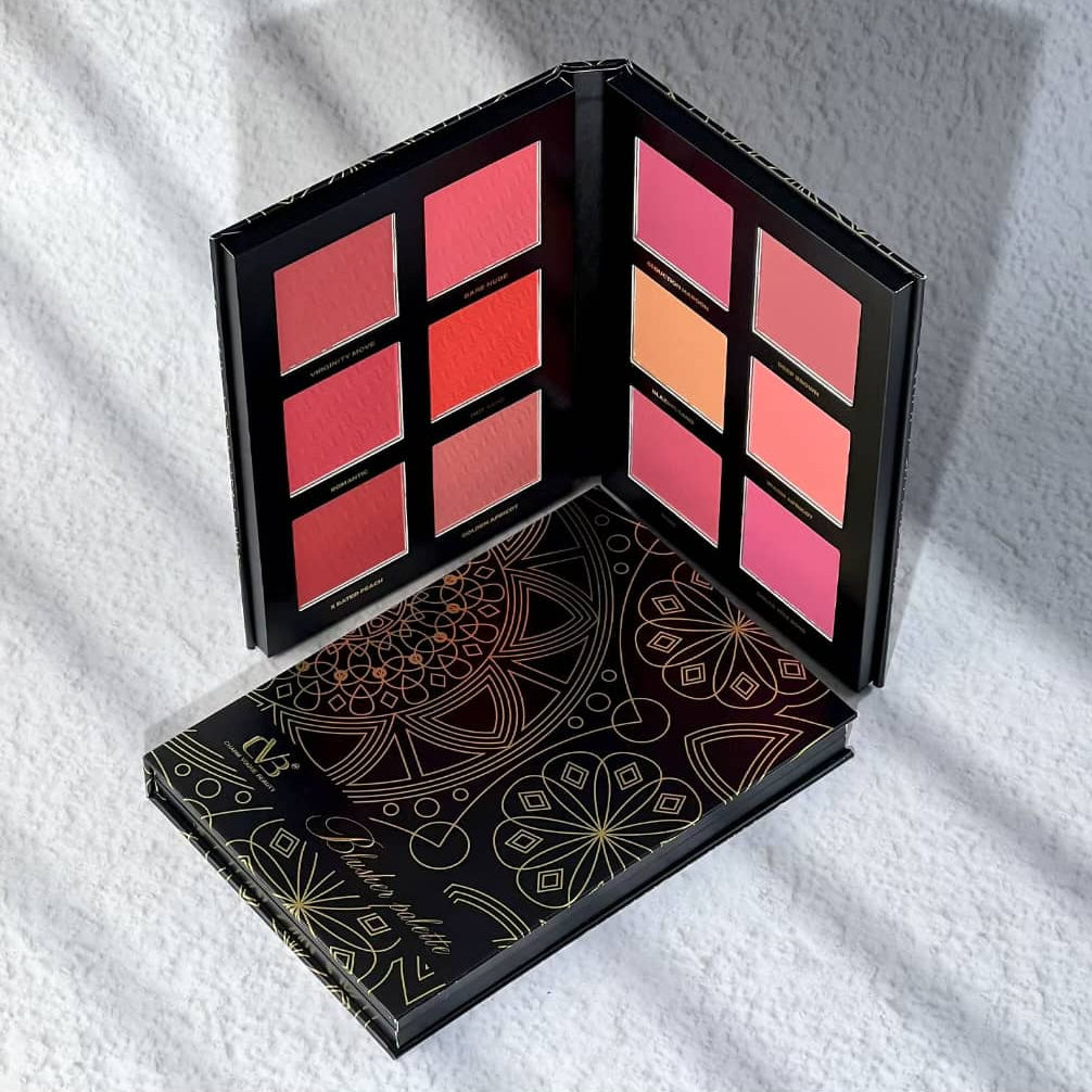 Makeup palette with colorful shades on a white textured surface