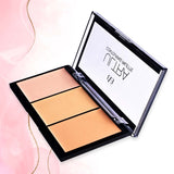 Makeup palette with three shades of beige on a pink background