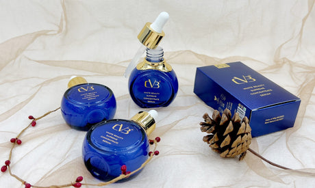 Cosmetic products with 'CVB' branding on a textured white background