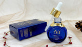 Blue dropper bottle with gold cap and 'CVB' branding on a white fabric background.