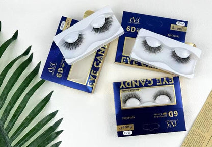 Eyelash products with packaging on a white surface