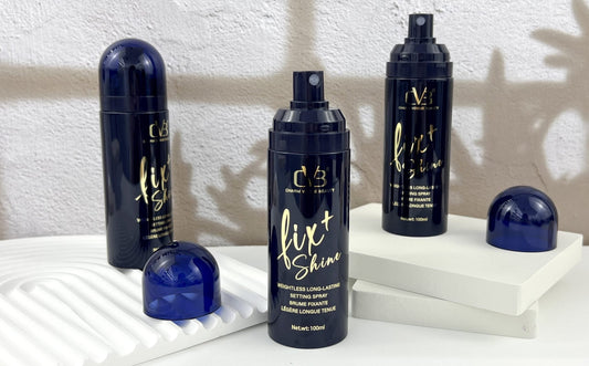 Three bottles of 'fix+ Shine' hair product on a white surface with a neutral background