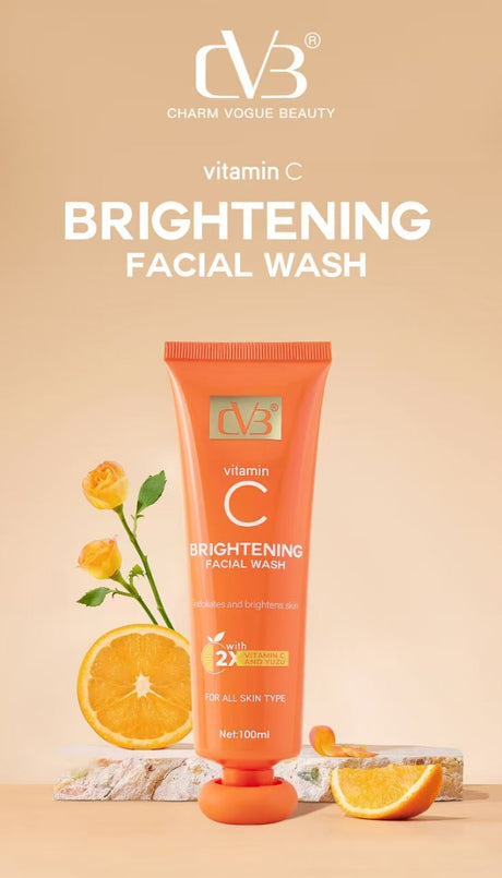 Orange facial wash tube with decorative elements on a beige background