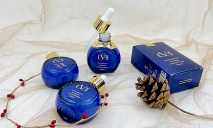 Cosmetic products with 'CVB' branding on a textured white background